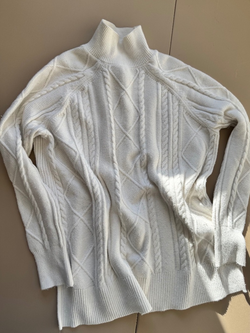 white turtle neck philosophy pull over sweater with slits